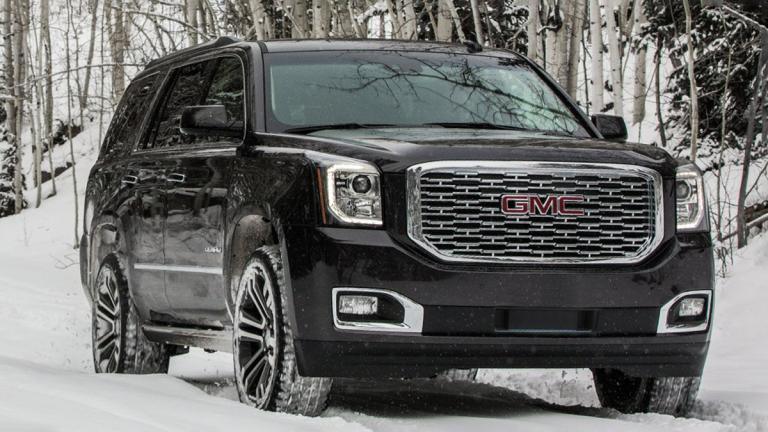 2018 GMC Yukon in black and on snow.
